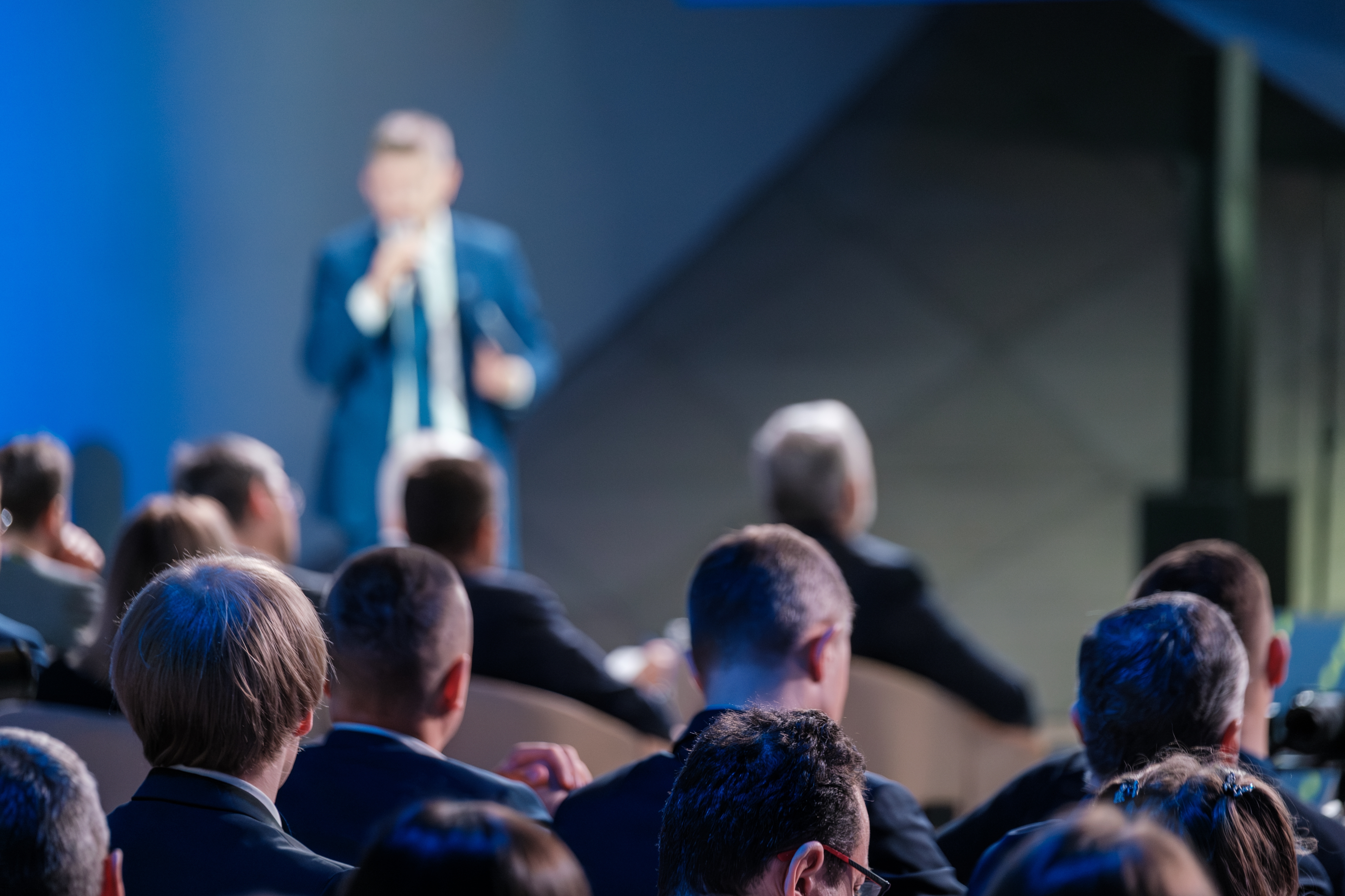 Man Speaking on Stage