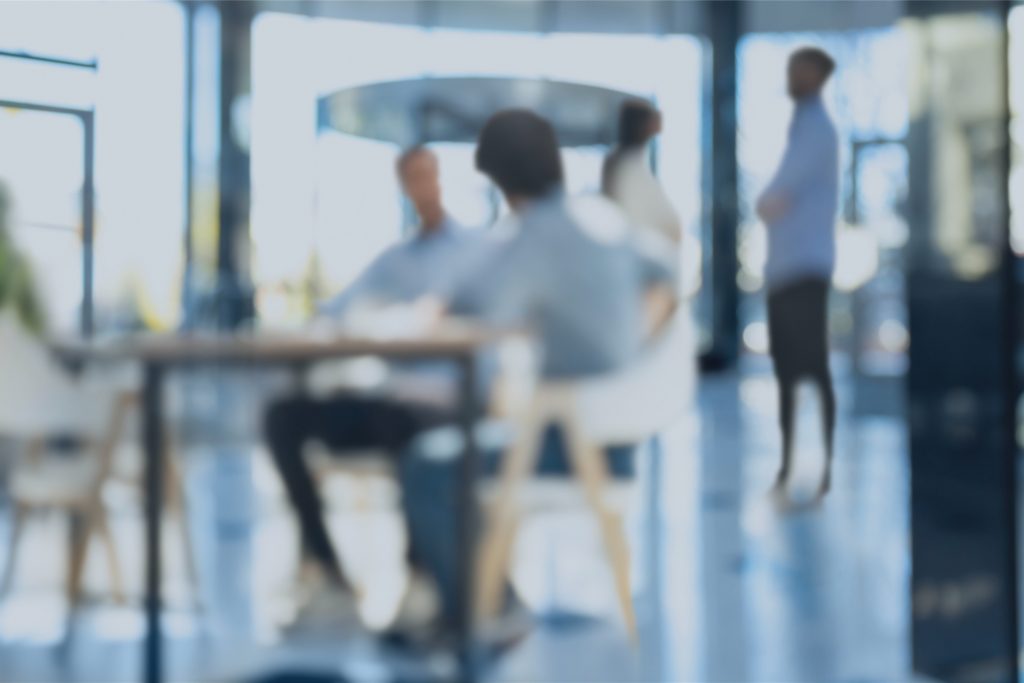 Informal team discussion in open office