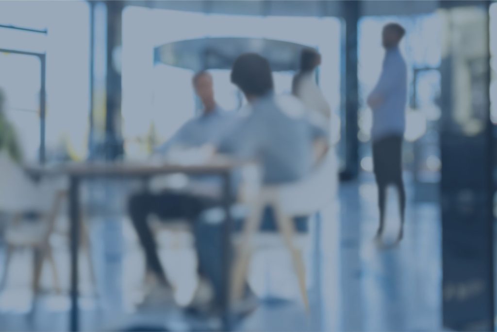Informal team discussion in open office